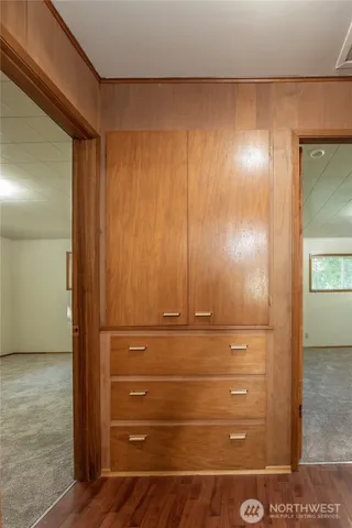 a kitchen with a refrigerator and a sink
