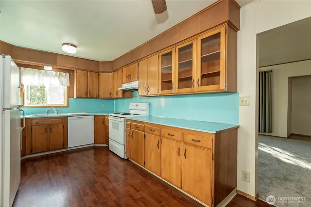 a kitchen with a sink and a window