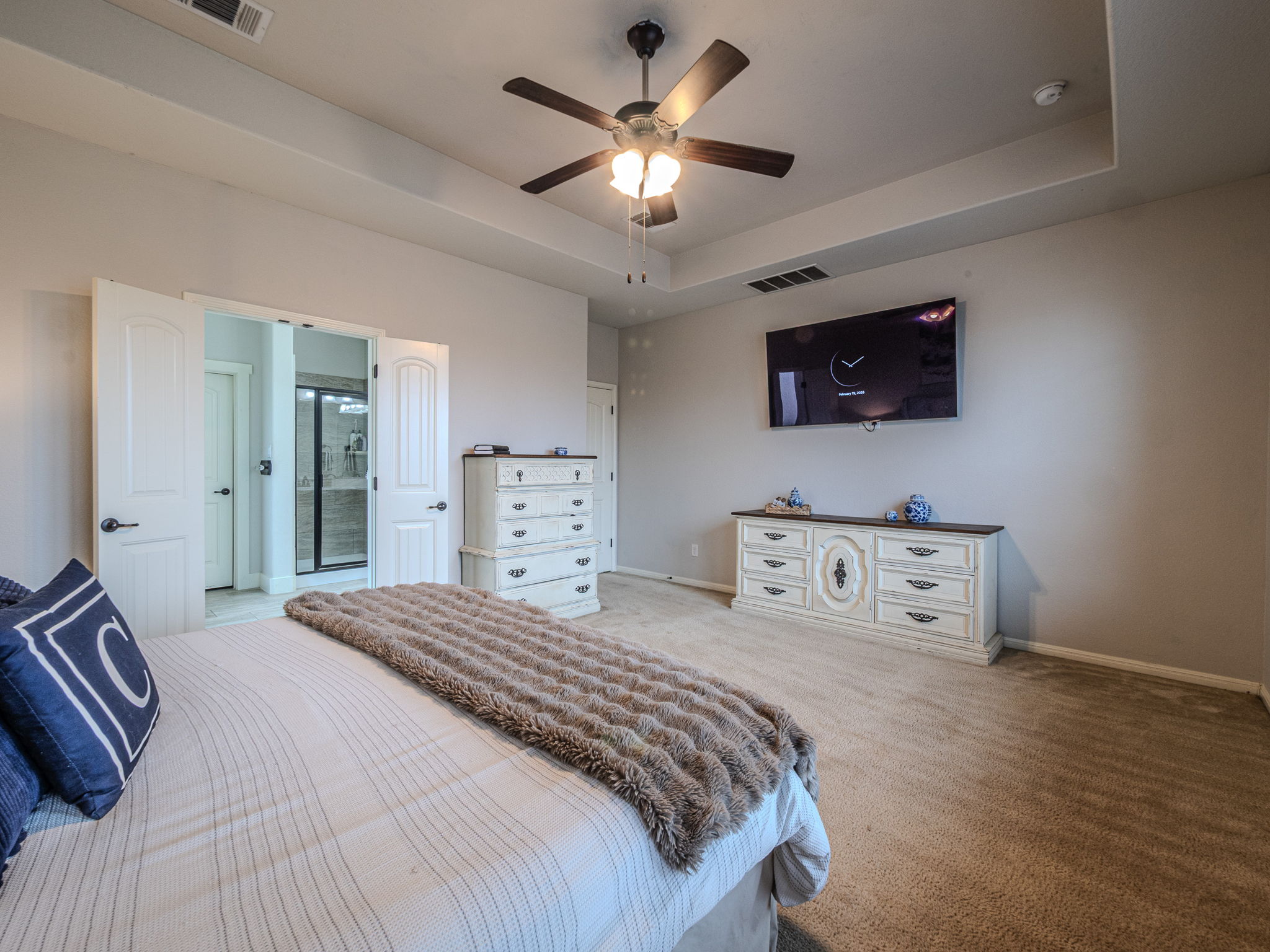 117 Arbor Point Drive Elgin, TX 78621 - Photo 14 of 40 a bedroom with furniture a flat screen tv and a bed