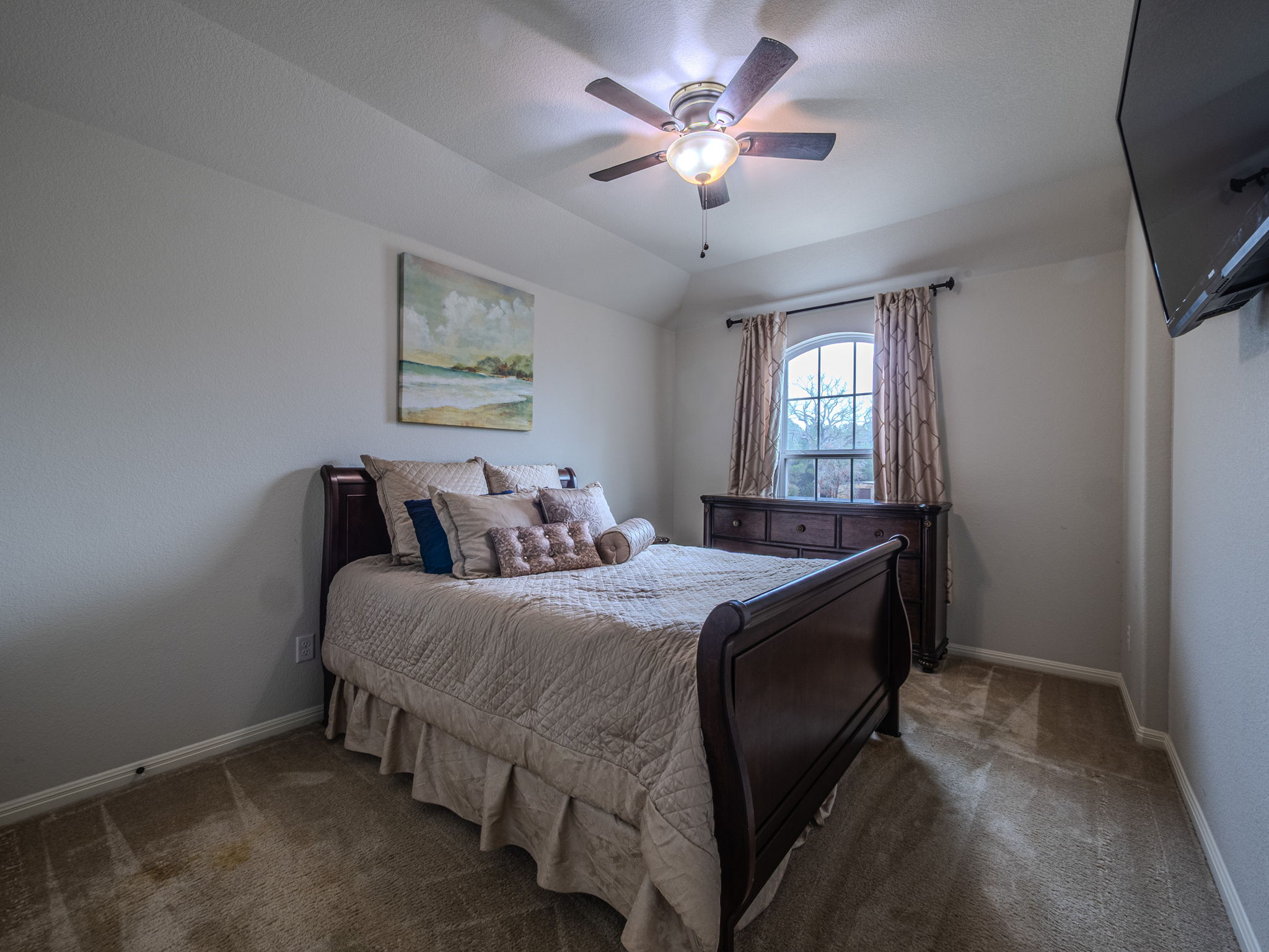 117 Arbor Point Drive Elgin, TX 78621 - Photo 23 of 40 a bedroom with a bed and a chandelier