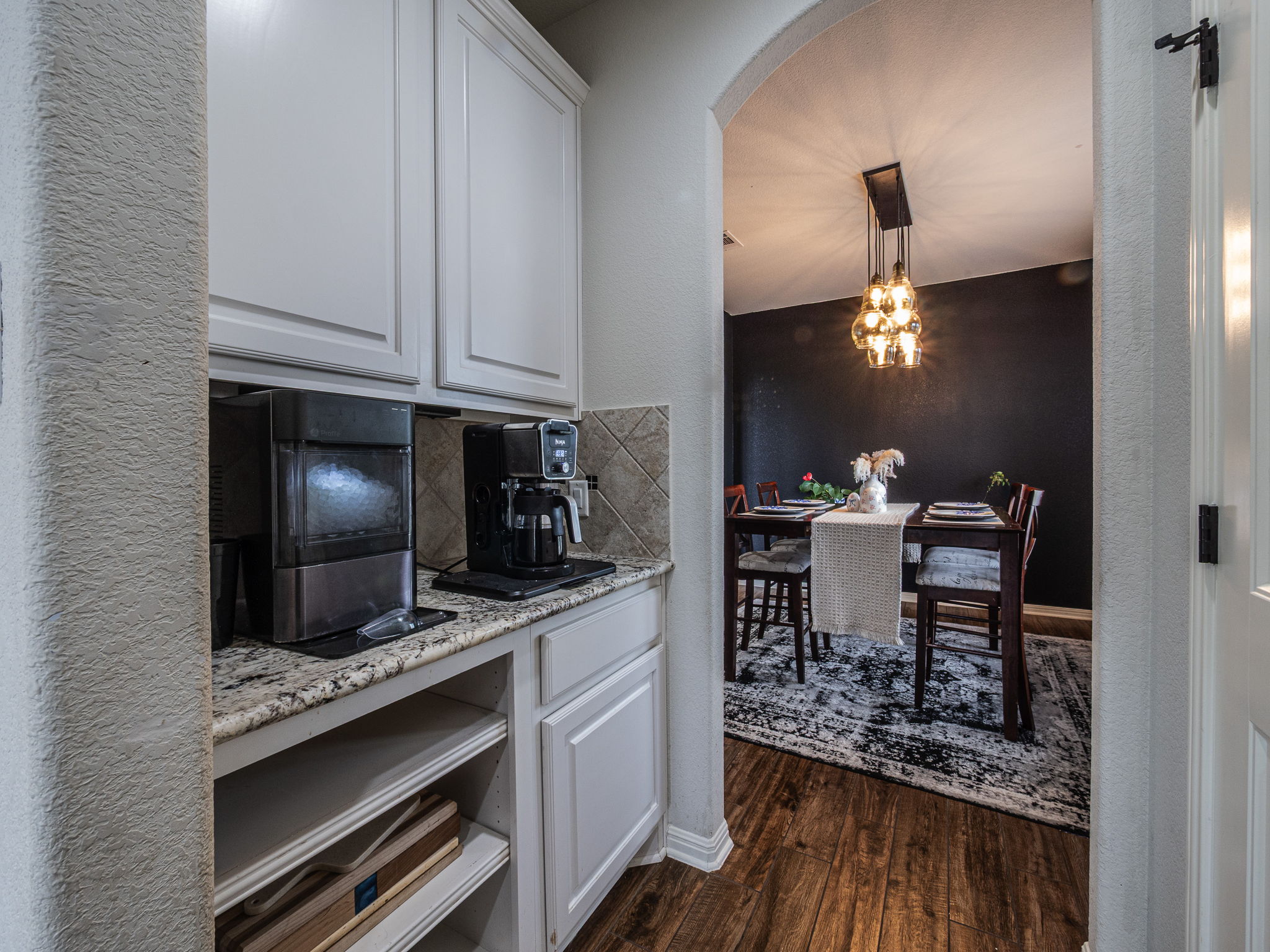 117 Arbor Point Drive Elgin, TX 78621 - Photo 9 of 40 a kitchen with appliances cabinets and a table