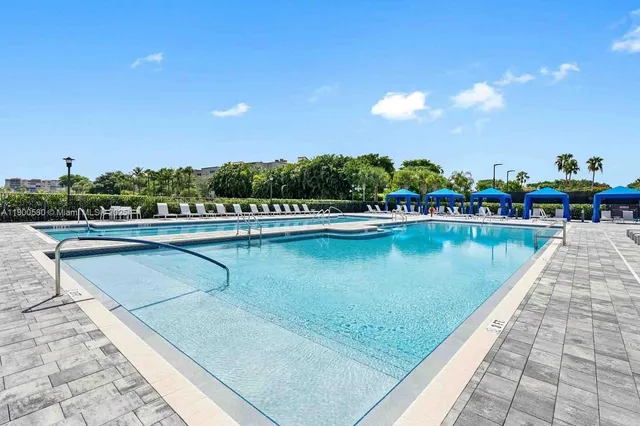 a view of swimming pool from a balcony