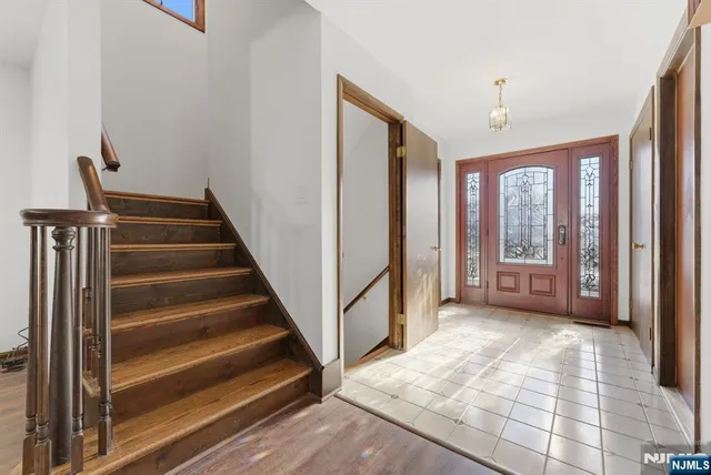 a view of an entryway with wooden floor and windows