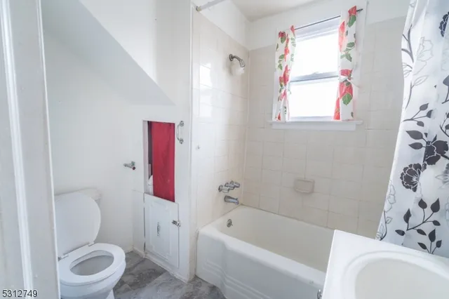 a bathroom with a toilet sink and bathtub