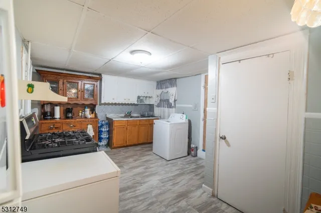 a kitchen with a refrigerator and a sink