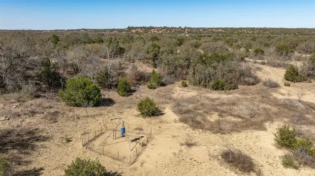 an aerial view of residential houses with city view