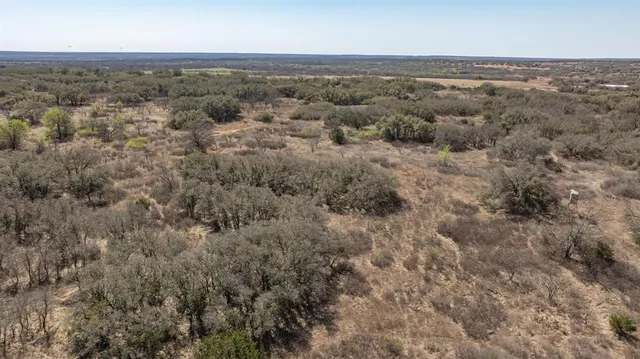an aerial view of house with yard