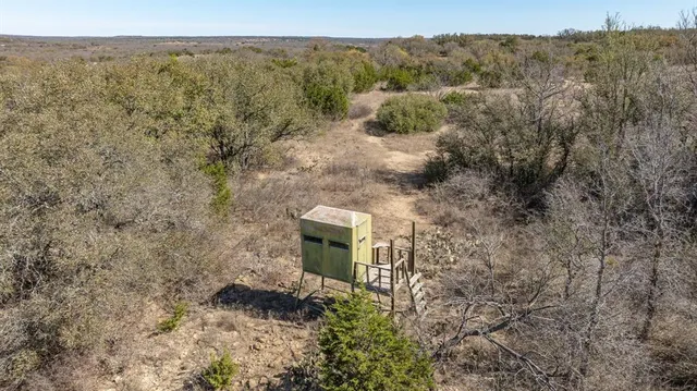 a view of a chairs in the middle of a field