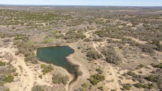 an aerial view of house with yard