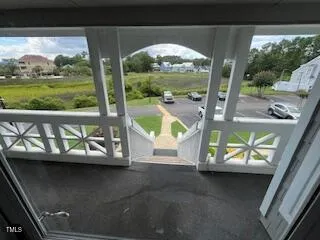 a view of a porch with a yard