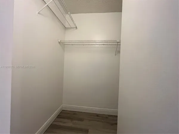 a view of an empty walk in closet