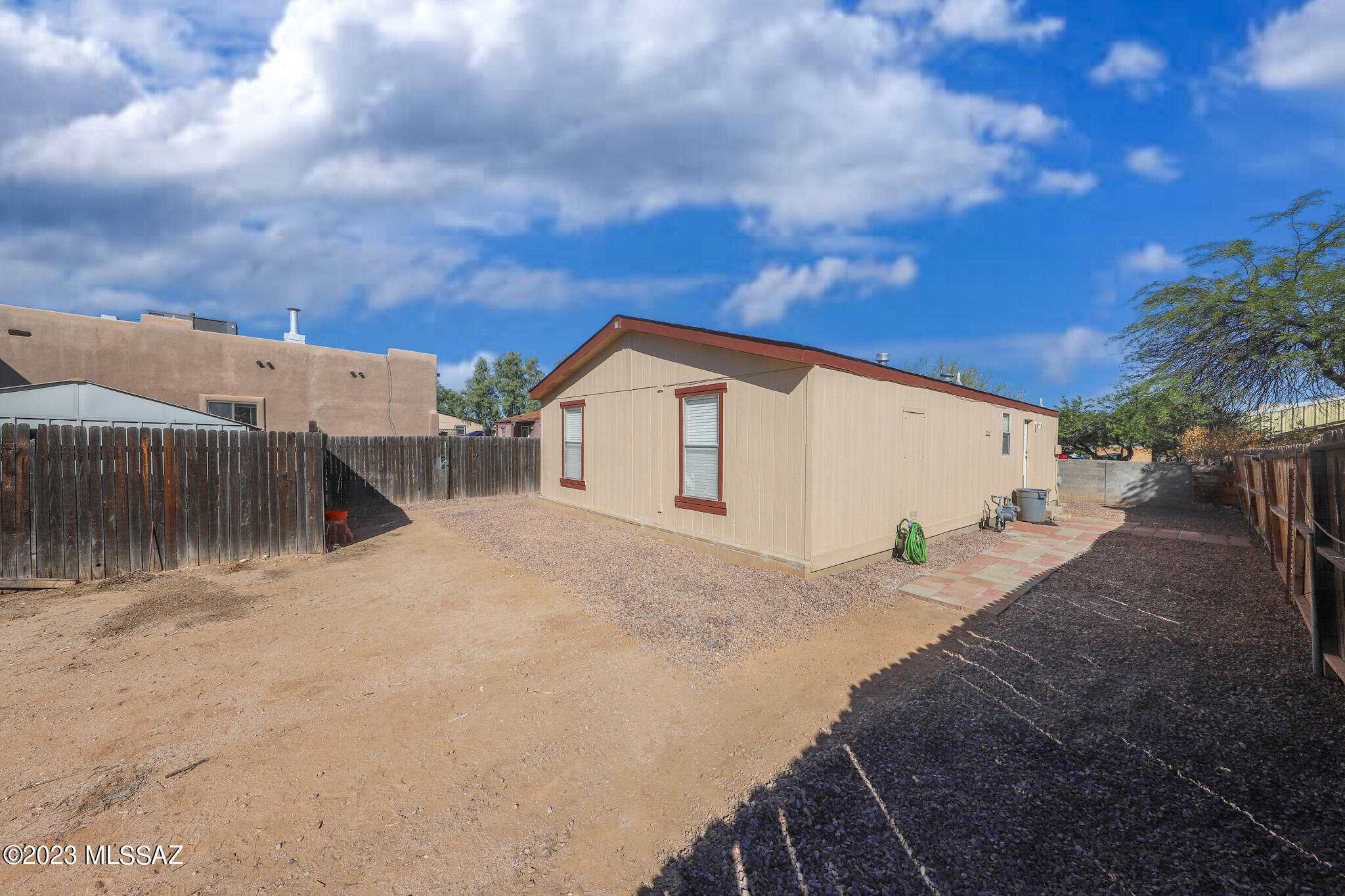 55 East King Road Tucson, AZ 85705 - Photo 3 of 26 a view of a house with wooden fence