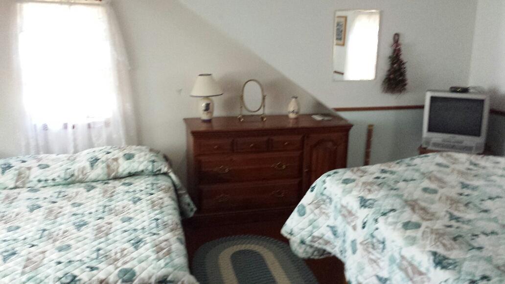70 Beaten Road Dennis Port, MA 02639 - Photo 11 of 14 a bedroom with a bed and dresser