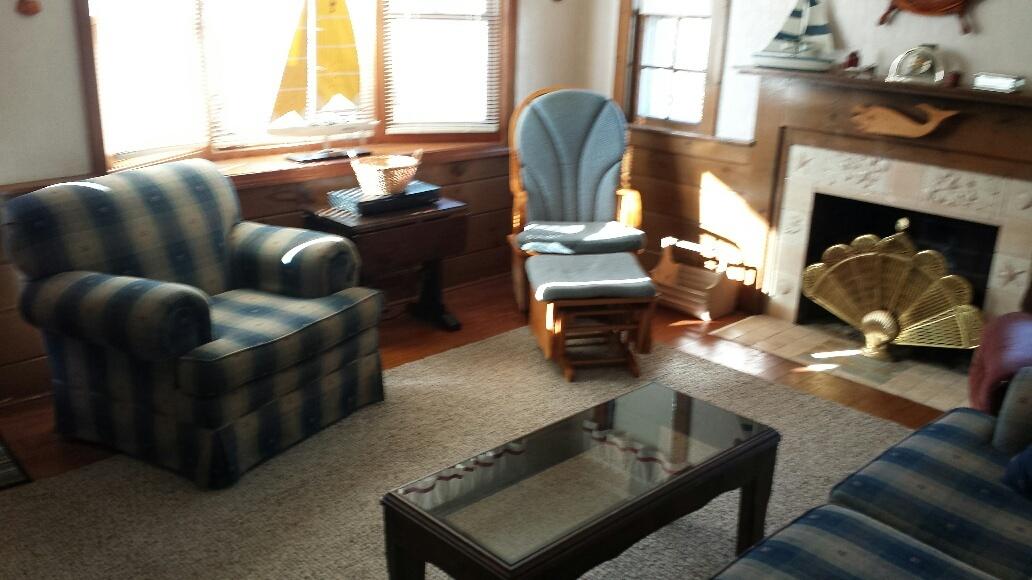 70 Beaten Road Dennis Port, MA 02639 - Photo 3 of 14 a living room with furniture and a fireplace