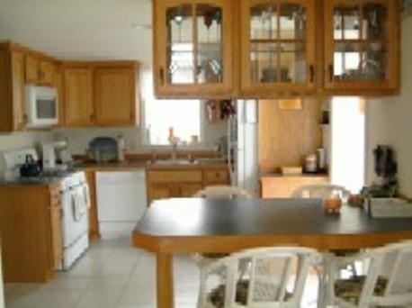 70 Beaten Road Dennis Port, MA 02639 - Photo 4 of 14 a kitchen with stainless steel appliances granite countertop a sink and a stove