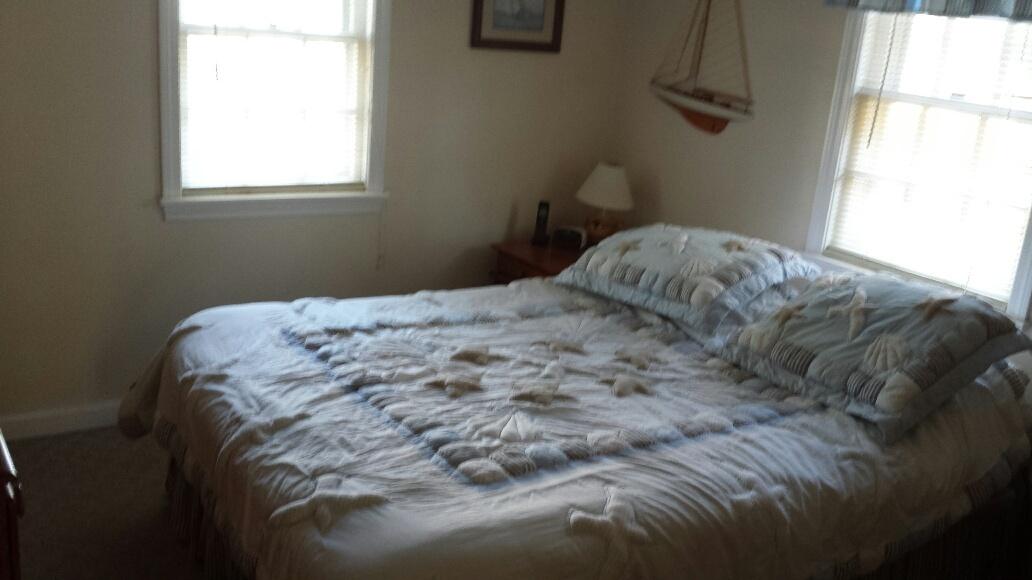 70 Beaten Road Dennis Port, MA 02639 - Photo 9 of 14 a bedroom with a bed next to a window