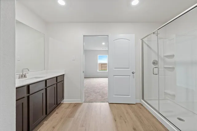 a bathroom with a sink and shower