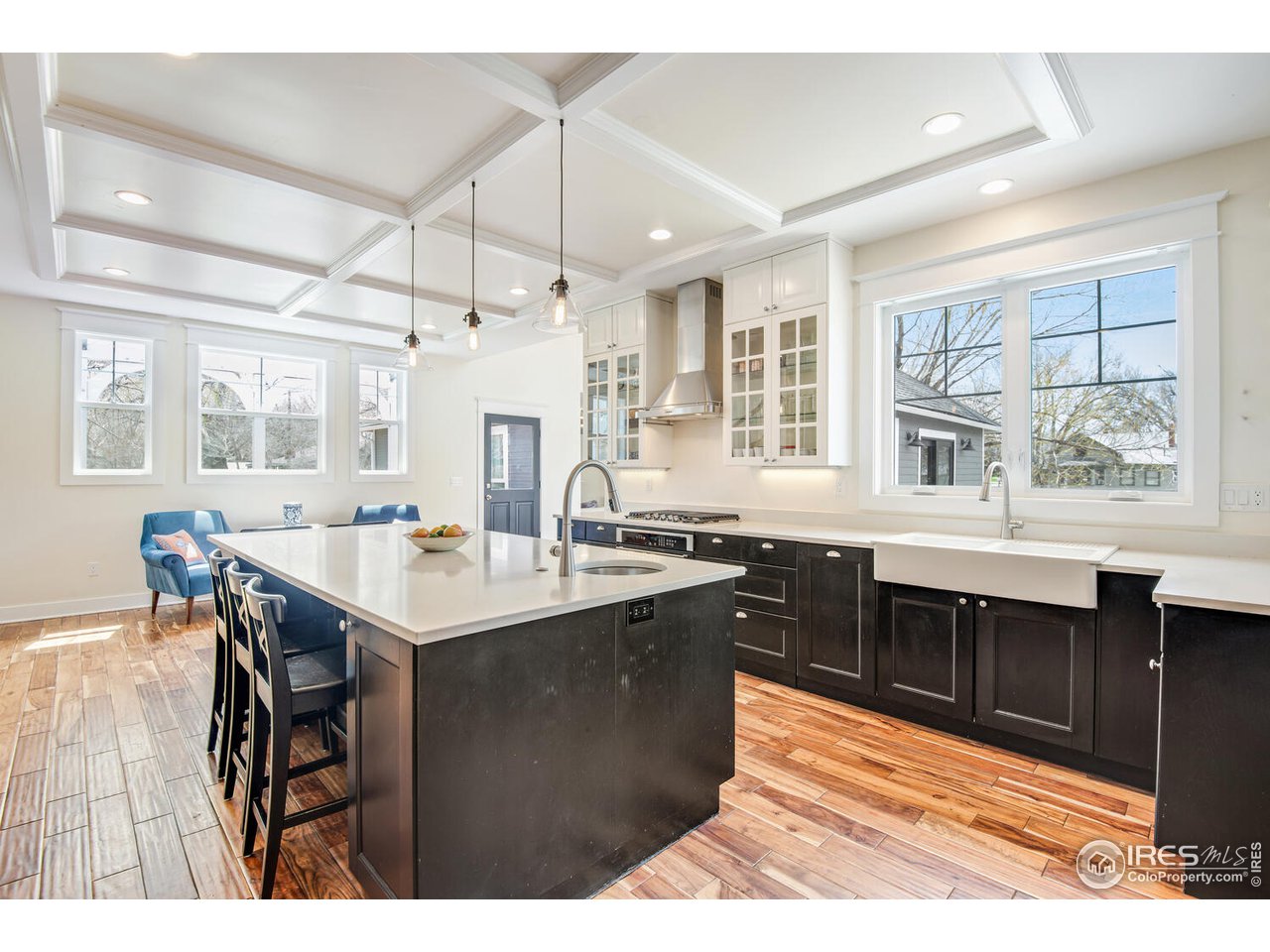6003 Indian Road Boulder, CO 80301 - Photo 14 of 40 a kitchen with granite countertop a sink cabinets and wooden floor