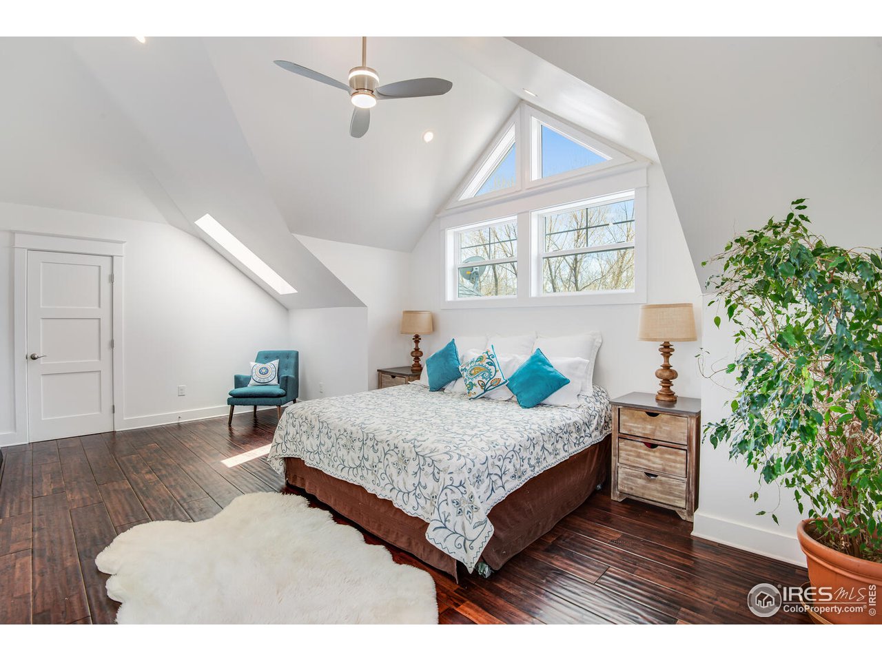 6003 Indian Road Boulder, CO 80301 - Photo 19 of 40 a bedroom with a bed window and a potted plant