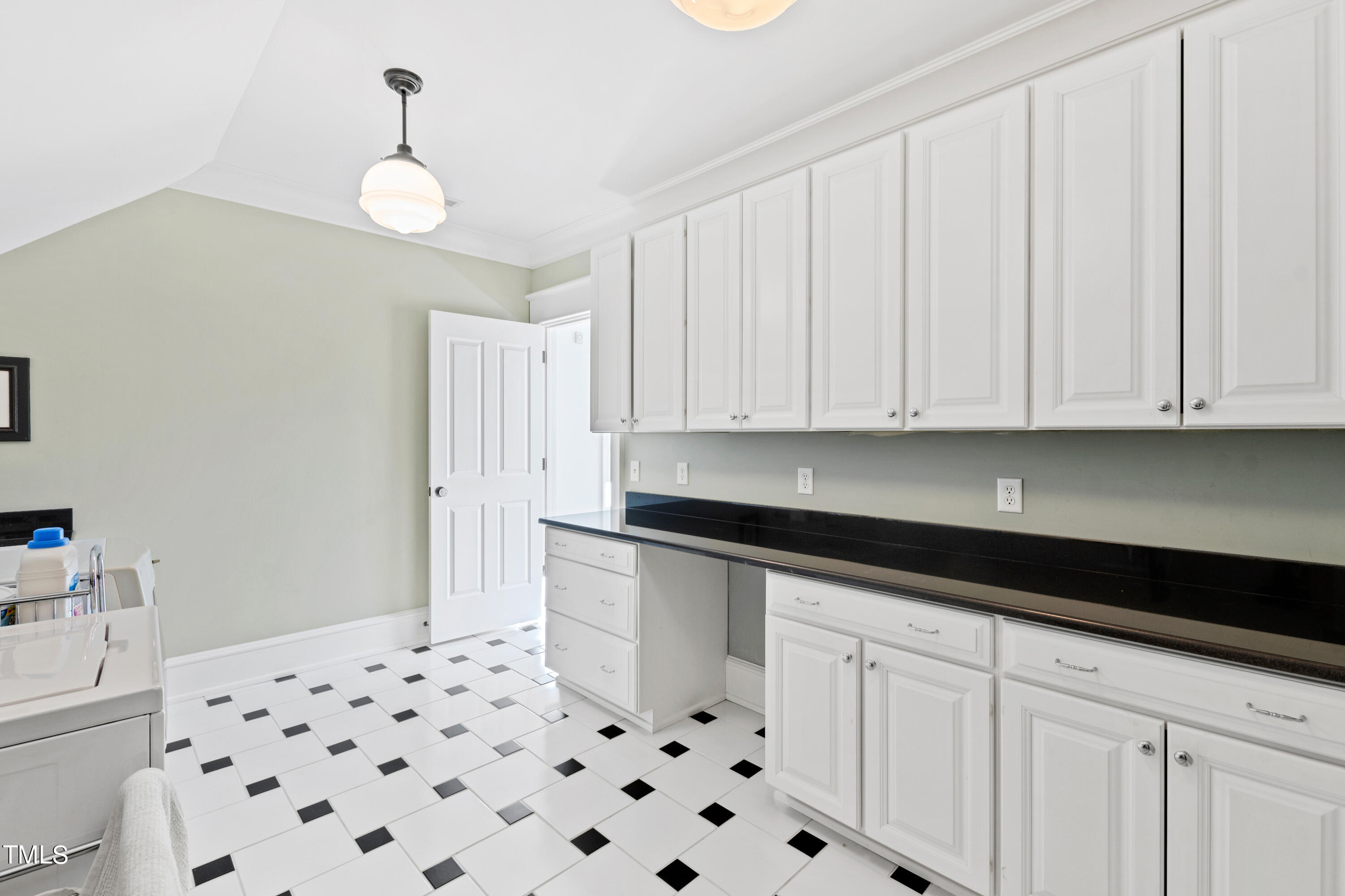 2309 Beechridge Road Raleigh, NC 27608 - Photo 54 of 83 a kitchen with granite countertop white cabinets and stainless steel appliances
