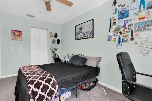 a bedroom with a bed and cabinets