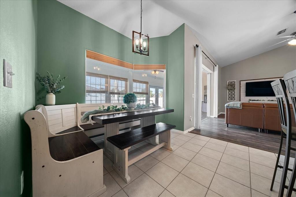 10080 Southeast 69th Terrace Belleview, FL 34420 - Photo 13 of 51 a kitchen with stainless steel appliances a stove a sink and a refrigerator