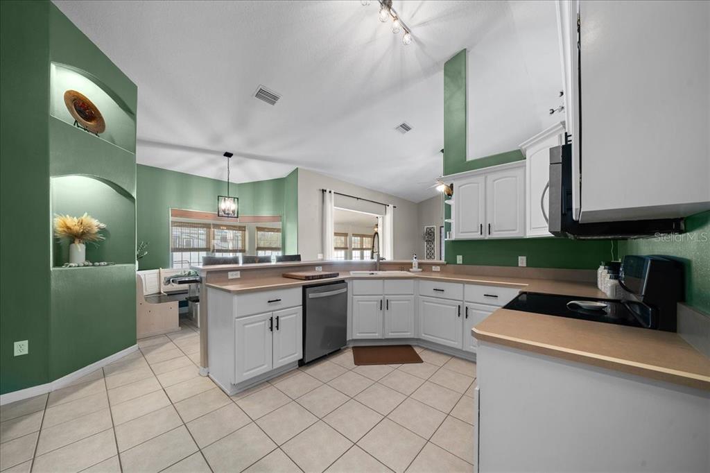 10080 Southeast 69th Terrace Belleview, FL 34420 - Photo 15 of 51 a kitchen with a sink and cabinets