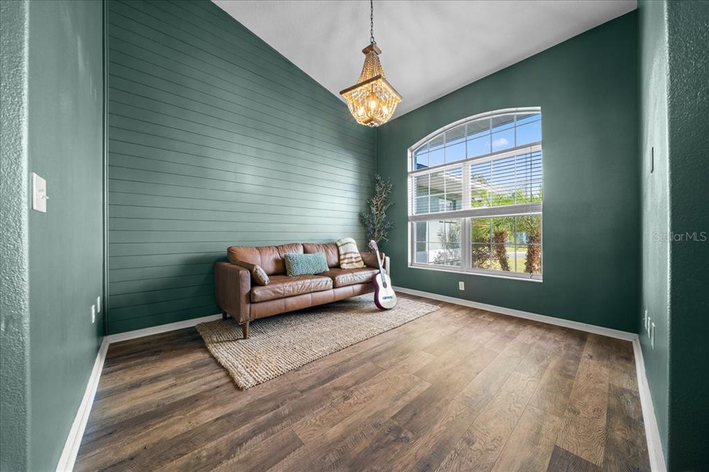 10080 Southeast 69th Terrace Belleview, FL 34420 - Photo 20 of 51 a living room with furniture and a window