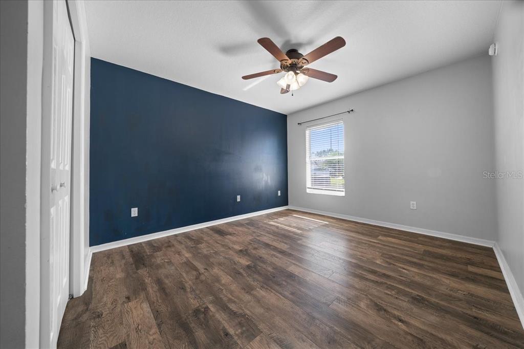 10080 Southeast 69th Terrace Belleview, FL 34420 - Photo 27 of 51 a view of a livingroom with a ceiling fan and window