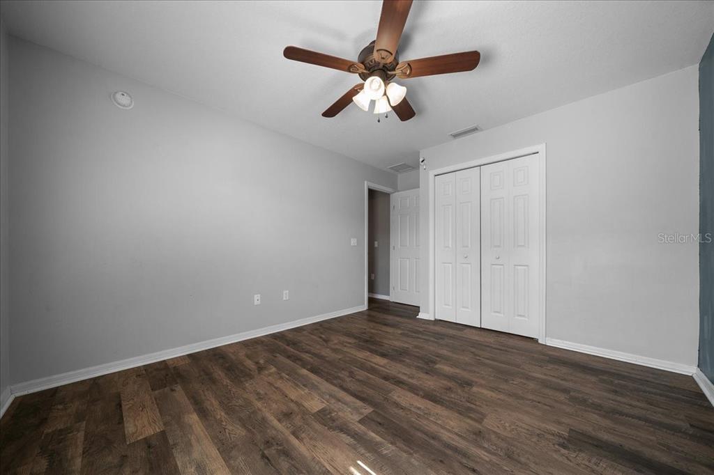 10080 Southeast 69th Terrace Belleview, FL 34420 - Photo 28 of 51 a view of an empty room with wooden floor