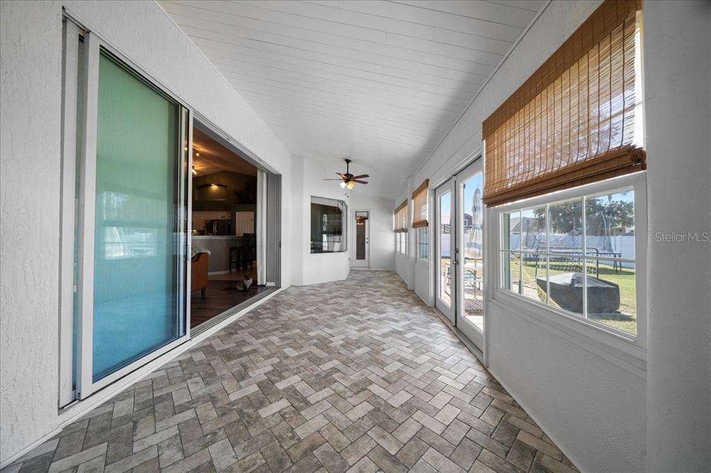 10080 Southeast 69th Terrace Belleview, FL 34420 - Photo 38 of 51 a big room with wooden floor and windows