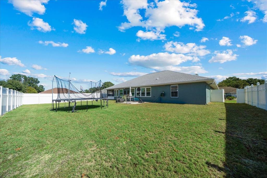 10080 Southeast 69th Terrace Belleview, FL 34420 - Photo 42 of 51 a house view with a garden space