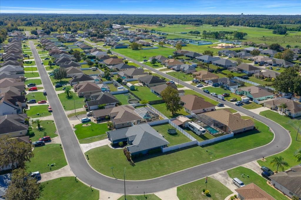 10080 Southeast 69th Terrace Belleview, FL 34420 - Photo 47 of 51 an aerial view of residential houses with outdoor space