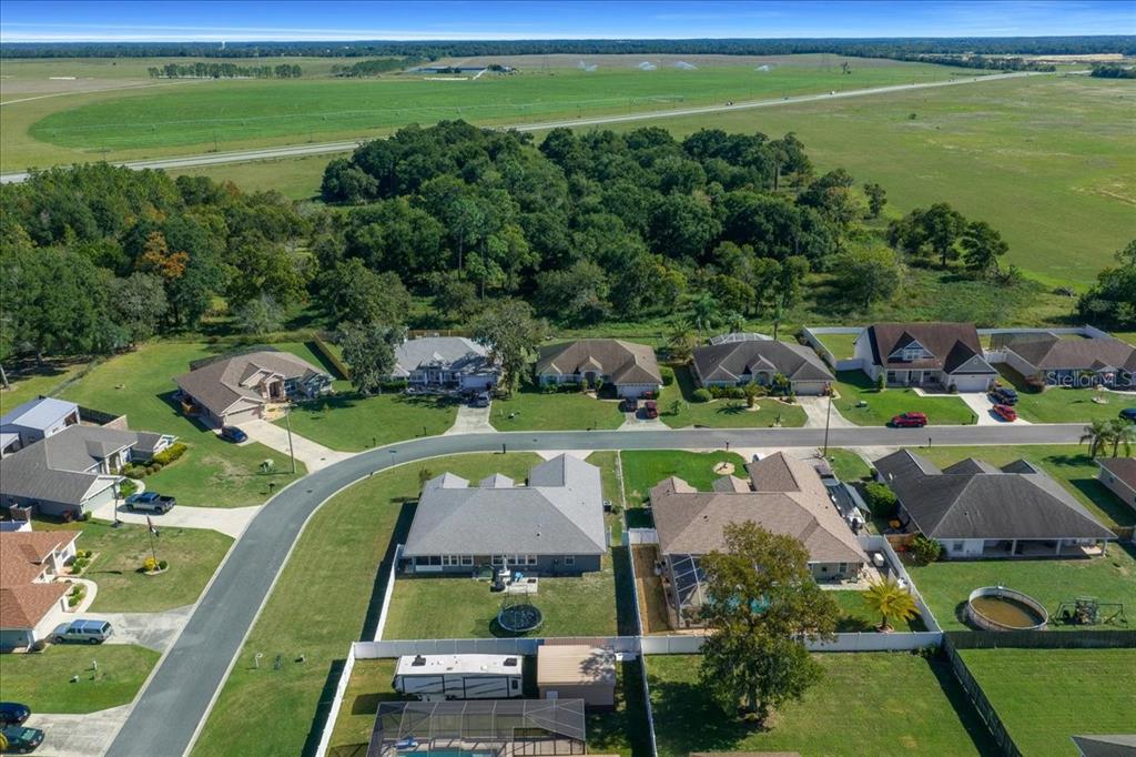 10080 Southeast 69th Terrace Belleview, FL 34420 - Photo 48 of 51 an aerial view of a golf course with a swimming pool