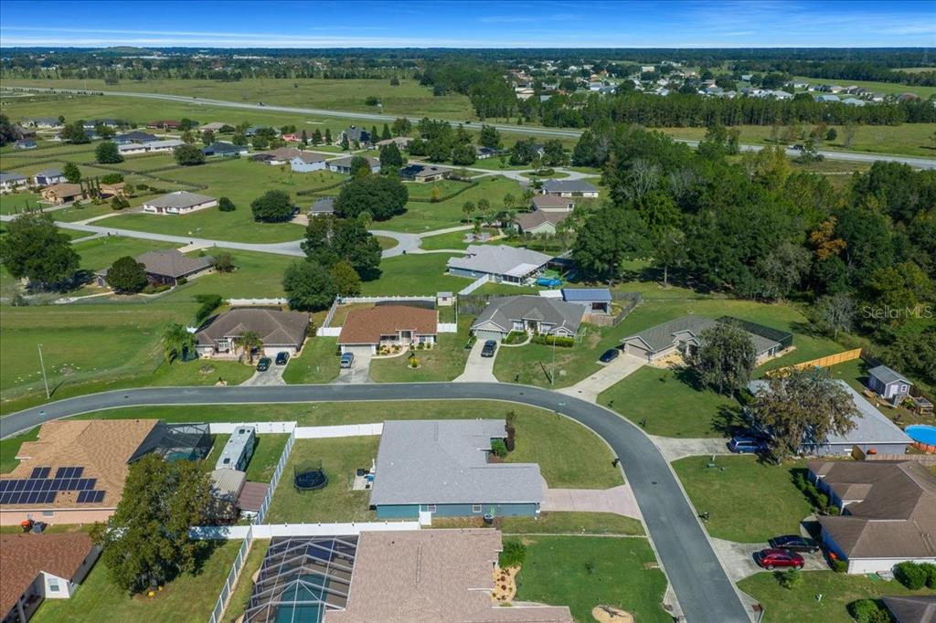 10080 Southeast 69th Terrace Belleview, FL 34420 - Photo 49 of 51 an aerial view of residential houses with outdoor space and street view