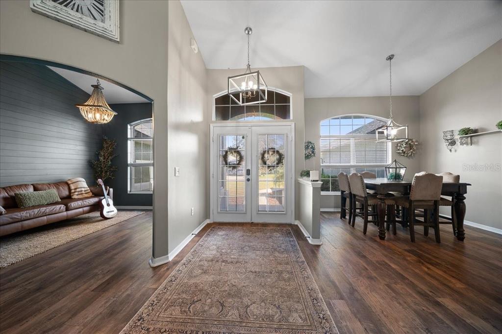 10080 Southeast 69th Terrace Belleview, FL 34420 - Photo 6 of 51 a view of a dining room with furniture window and wooden floor