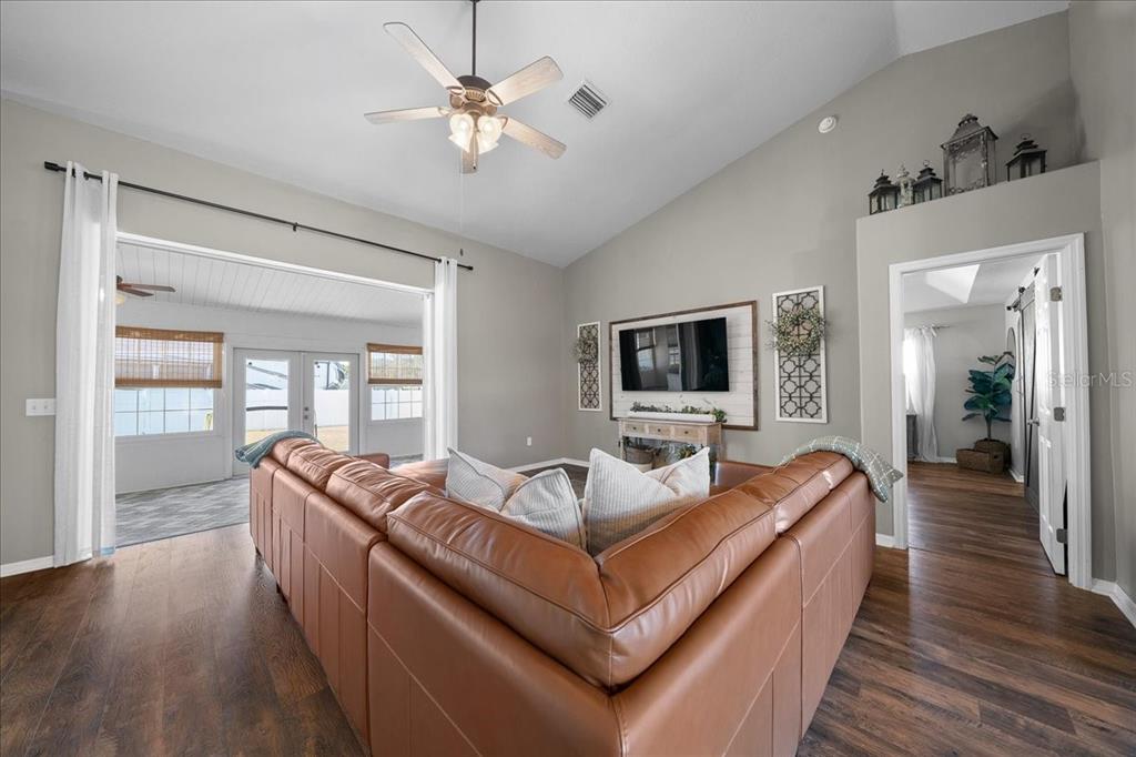 10080 Southeast 69th Terrace Belleview, FL 34420 - Photo 7 of 51 a living room with furniture and a wooden floor