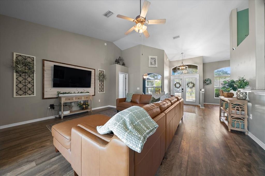 10080 Southeast 69th Terrace Belleview, FL 34420 - Photo 10 of 51 a living room with furniture and a flat screen tv