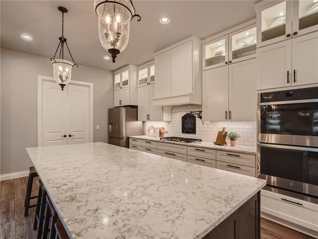 132 Huerta Road Florence, TX 76527 - Photo 10 of 40 An inviting kitchen with a generously sized island, perfect for culinary endeavors and casual dining.