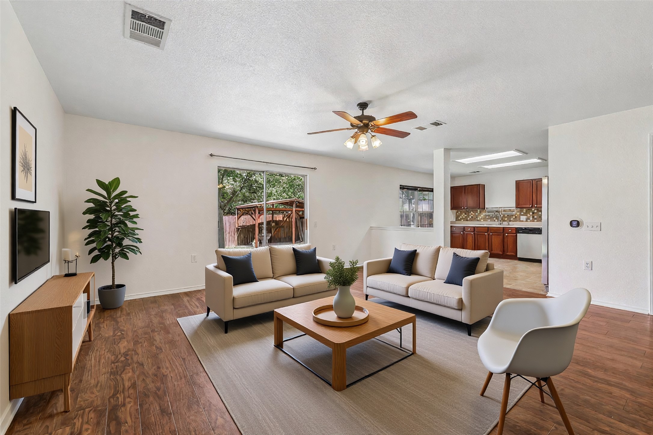 7658 Marble Ridge Drive Austin, TX 78747 - Photo 34 of 34 a living room with furniture potted plant and a window