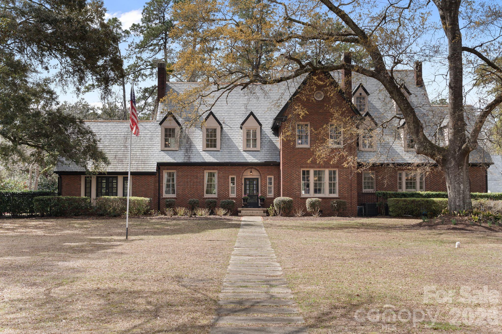 1503 Elm Street Conway, SC 29526 - Photo 2 of 48 a front view of a building with a snow on the road