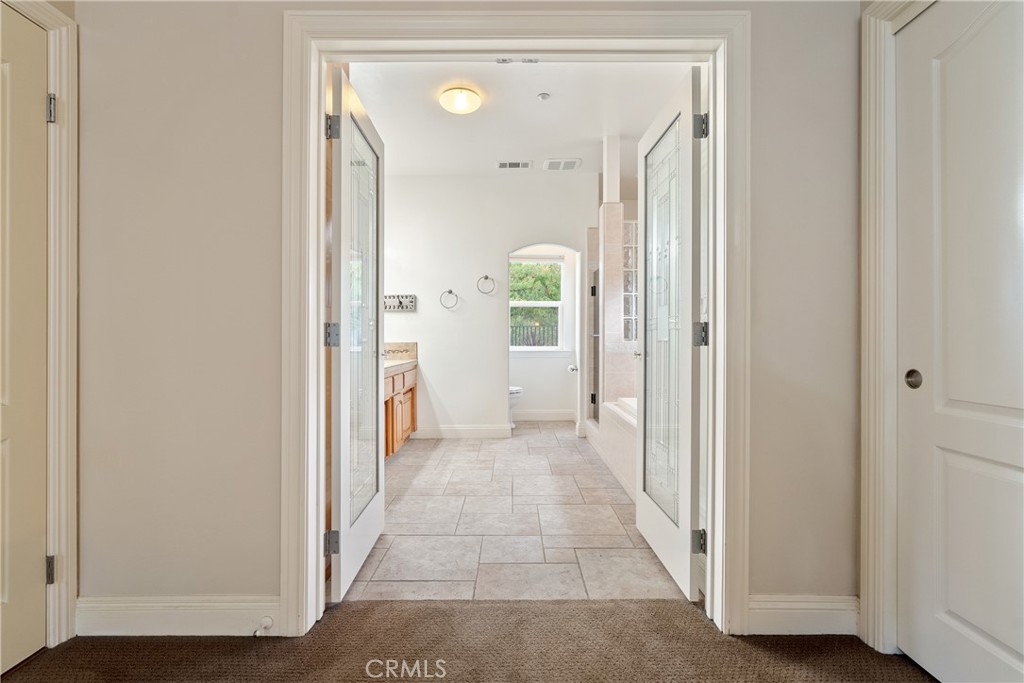 10844 Vista Atascadero Ca Atascadero, CA 93422 - Photo 30 of 74 a view of a hallway with wooden floor and a bathroom