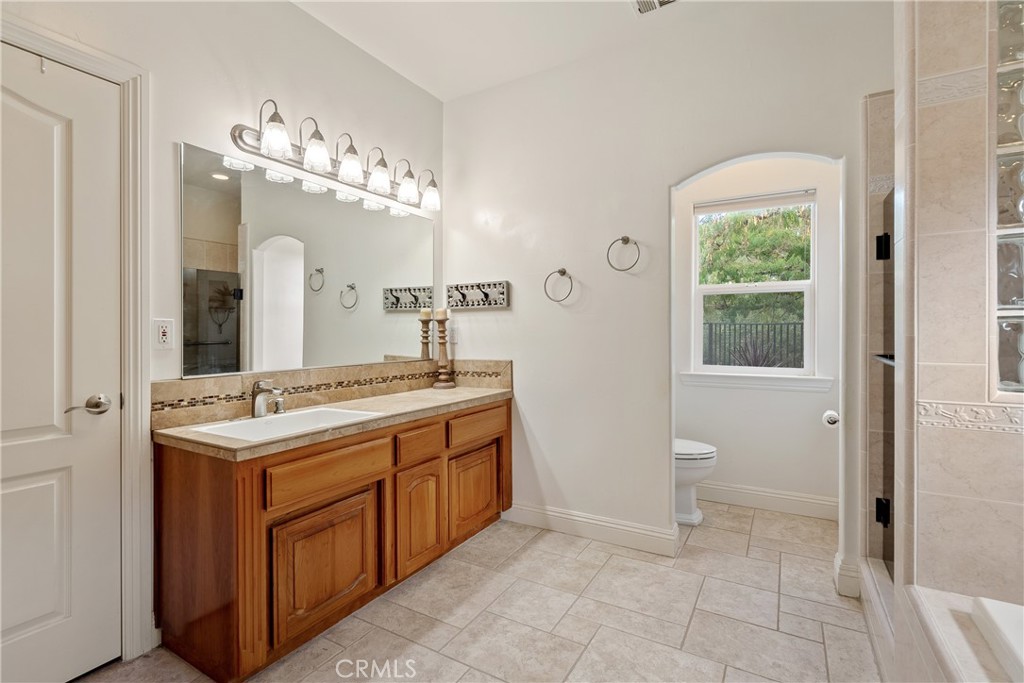 10844 Vista Atascadero Ca Atascadero, CA 93422 - Photo 31 of 74 The ensuite provides a sizable vanity with tile countertop and tile floors.