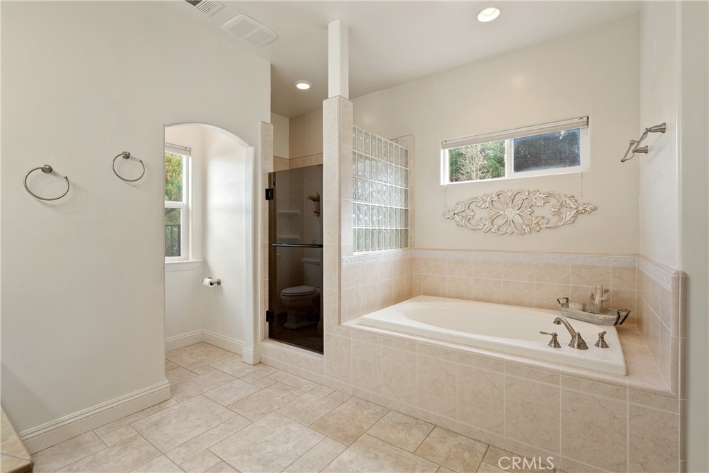 10844 Vista Atascadero Ca Atascadero, CA 93422 - Photo 32 of 74 a bathroom with a bathtub and shower