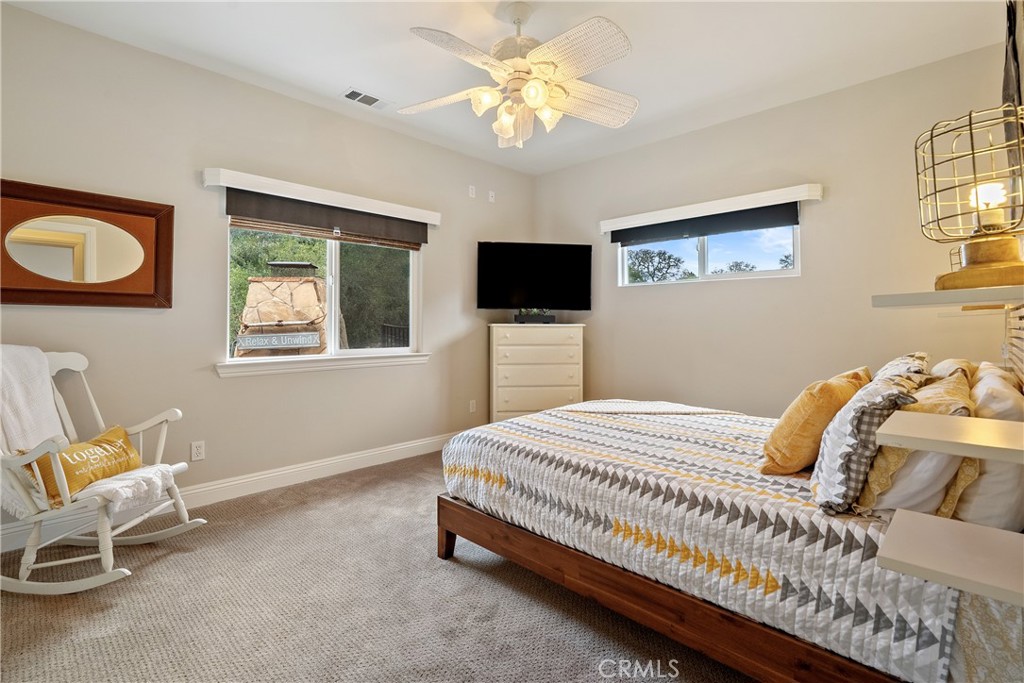 10844 Vista Atascadero Ca Atascadero, CA 93422 - Photo 35 of 74 a bedroom that has a bed and a chair in it