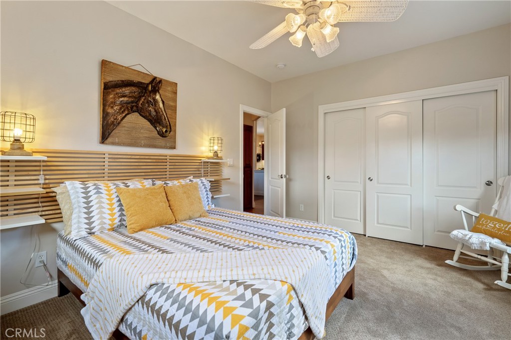 10844 Vista Atascadero Ca Atascadero, CA 93422 - Photo 36 of 74 a bedroom with a bed and a chandelier