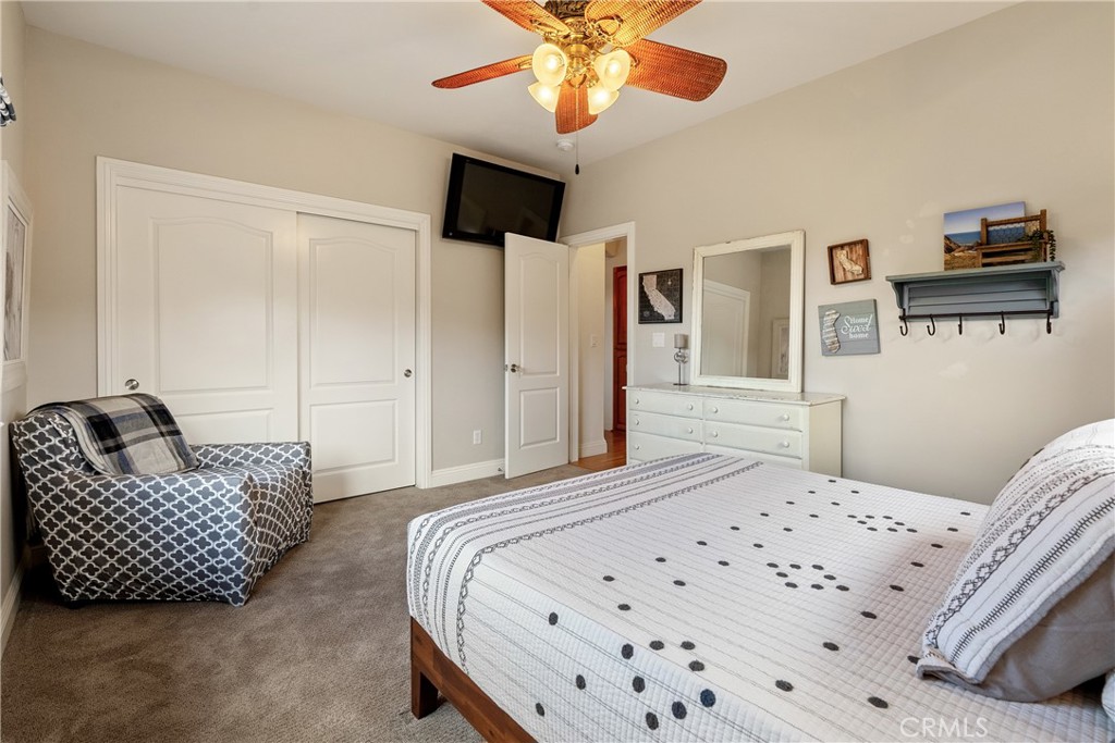 10844 Vista Atascadero Ca Atascadero, CA 93422 - Photo 39 of 74 a bedroom with a bed and a chandelier