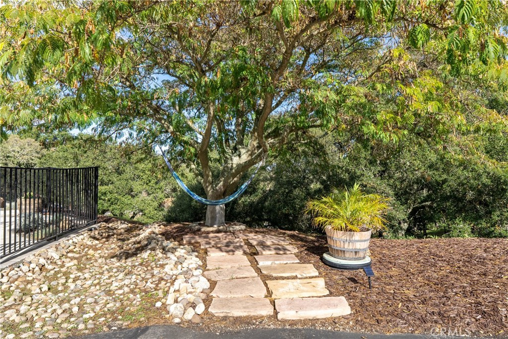 10844 Vista Atascadero Ca Atascadero, CA 93422 - Photo 43 of 74 a view of a backyard with table and chairs potted plants and wooden fence