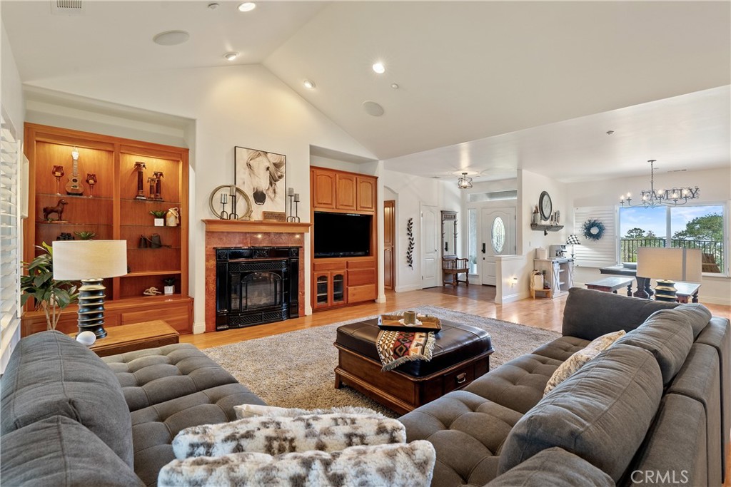 10844 Vista Atascadero Ca Atascadero, CA 93422 - Photo 9 of 74 a living room with furniture a fireplace and a flat screen tv