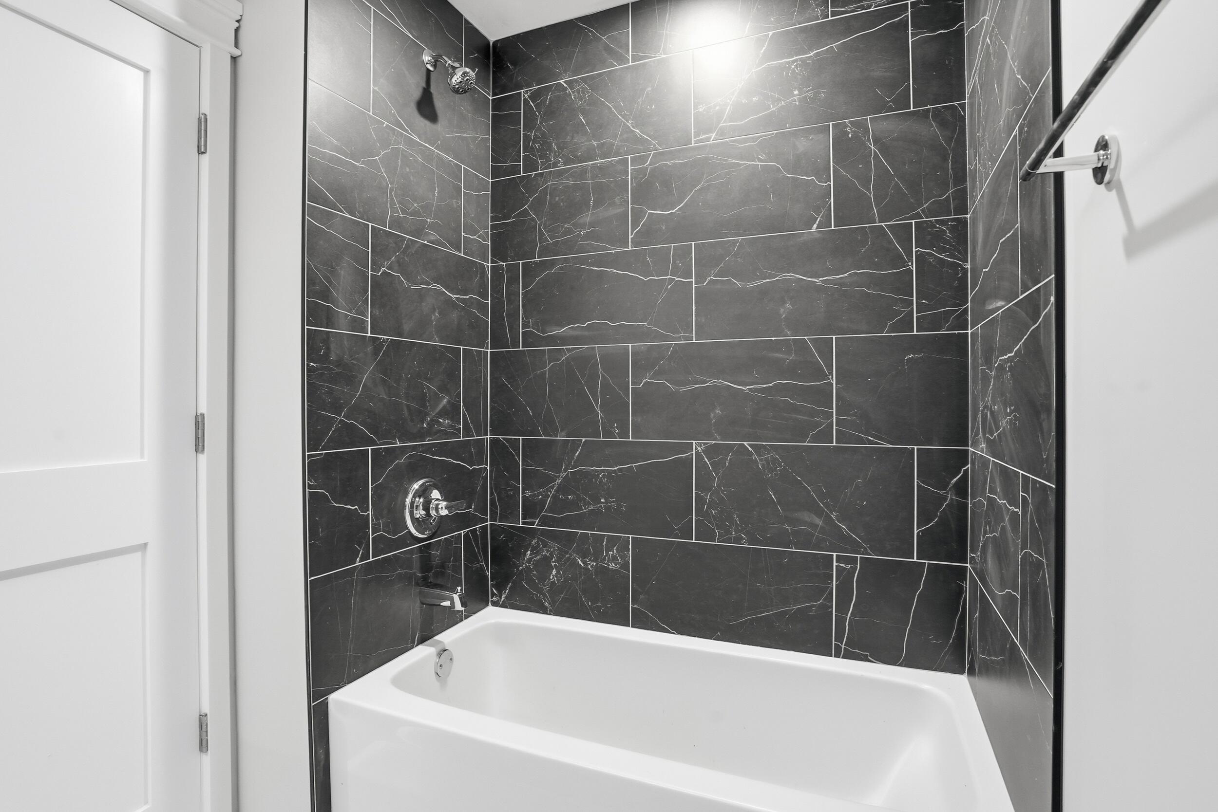 1540 119th Street, Unit 201 Whiting, IN 46394 - Photo 11 of 17 a bathroom with a bath tub and shower